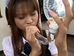Japanese maid drinks piss from a directely filled funnel